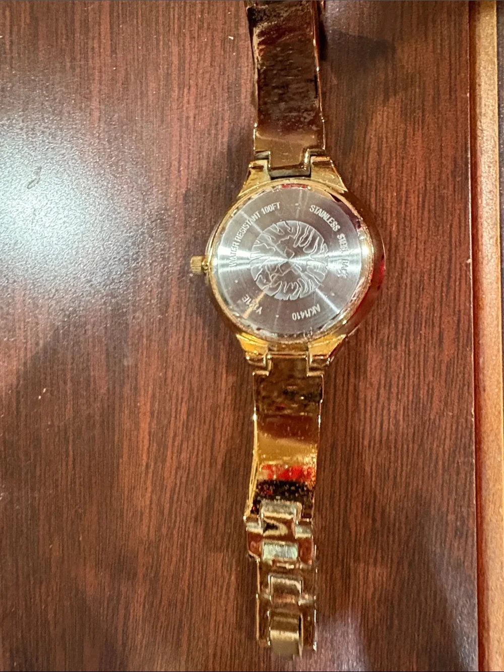 Anne Klein Gold Tone Bracelet Watch with Single Diamond Accent